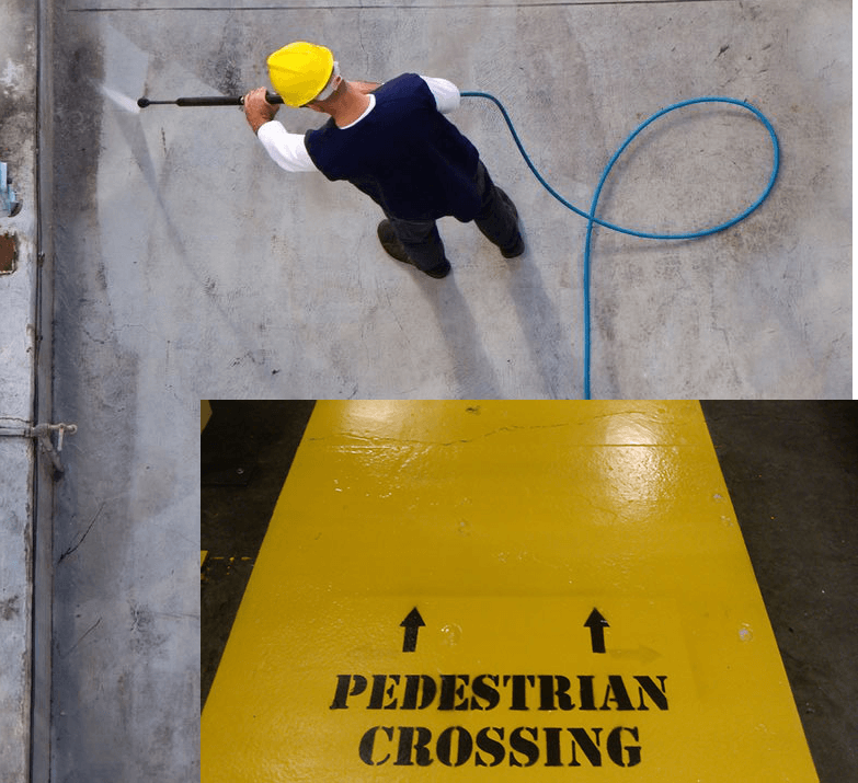 A man in yellow hard hat holding a hose.